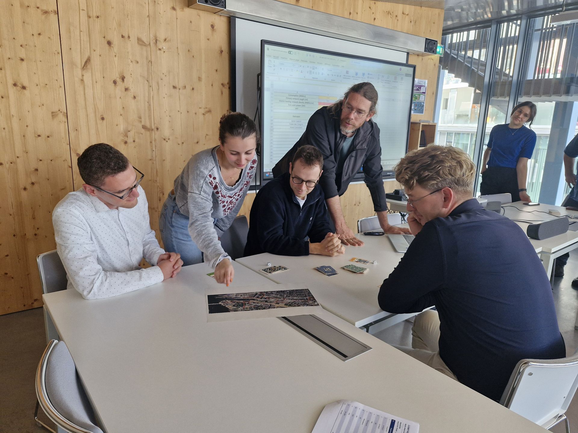 The AquaCOM team plays a board game designed by SPL BER